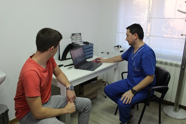 A conversation between a chiropractor and a patient A conversation between a chiropractor and a patient